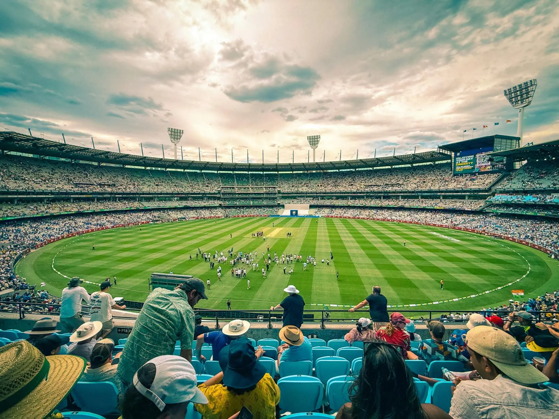 Crowd watching cricket at the MCG in Melbourne on a summer day